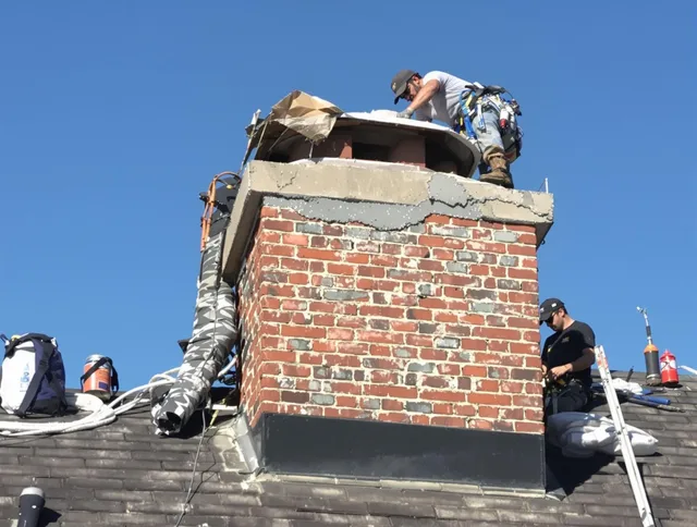 The Hammocks Chimney Sweep installing a custom chimney crown in The Hammocks, FL