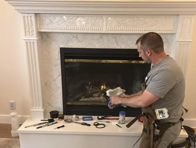 The Hammocks Chimney Sweep performing fireplace maintenance in The Hammocks, FL