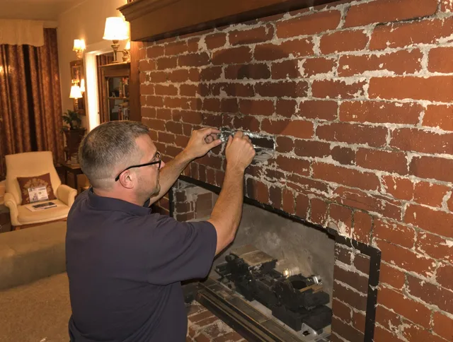 The Hammocks Chimney Sweep expert fixing a fireplace in The Hammocks, FL